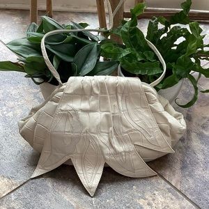 La Bottega leather bag w leather flower flap enclosure